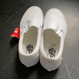 Women’s white Vans slip ons